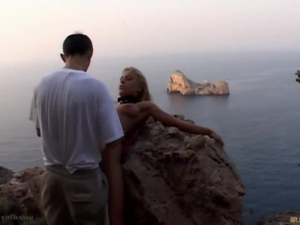Promiscous blonde tied and fucked on a cliff